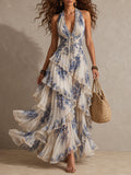 Maxi Abito Floreale Blu e Bianco con Collo Halter e Dettagli Volant